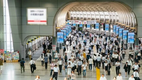 Timelapse of Rush Hour Commuters at Station in Tokyo -Pan Right- Stock Footage