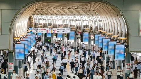 Timelapse of Rush Hour Commuters at Station in Tokyo -Long Shot- Stock Footage