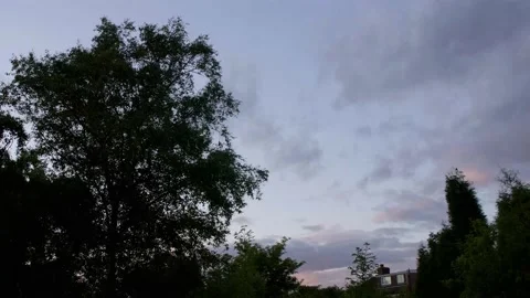 Timelapse of a rushing cloud speckled sunset sky Stock Footage 132144587
