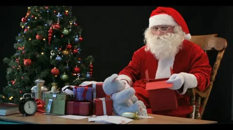 Timelapse of Santa wrapping gifts Stock Footage