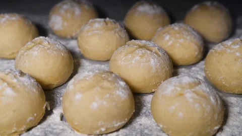Timelapse of sausage in dough baking in oven. Bakery rising up in oven. Baking Stock Footage 336576707