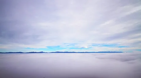 Timelapse scenery with clouds, dense layer of fog and mountain peaks Stock Footage 34162737