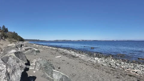 Timelapse of a scenic beach with large rocks and a sandy shore Stock Footage 285466041