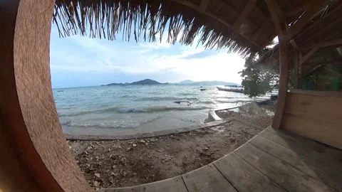 Timelapse of sea, beach, waves, splashes taken from gazebos Stock-Footage 269486661