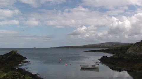 Timelapse on sea inlet, with clouds and boat Stock Footage 33846070