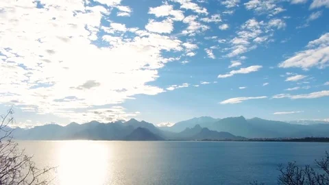 Timelapse. Sea view at sun rays on the mountains background. Stock Footage 84129022