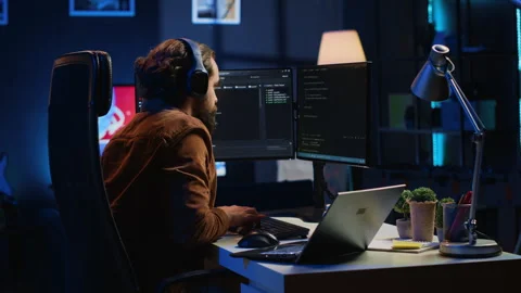 Timelapse of self employed computer scientist typing complex code in home office Video stock 265515465