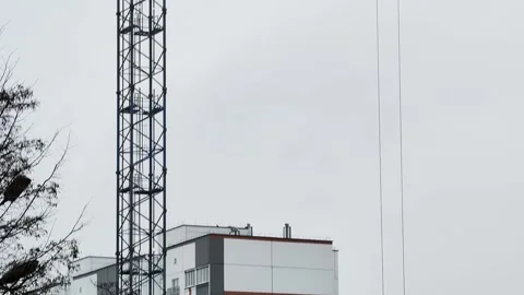 Timelapse sequence of large industrial tower crane assembly showing construction Stock Footage 344845174