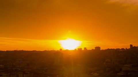 Timelapse: setting sun coloring red clouds over Istanbul after rain Stock Footage 341286725