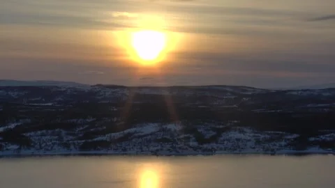 Timelapse of the setting sun in an orange cloudy sky Stock Footage 321141647