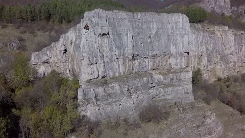 Timelapse shadow covering a massive rock formation 库存影片 347809838
