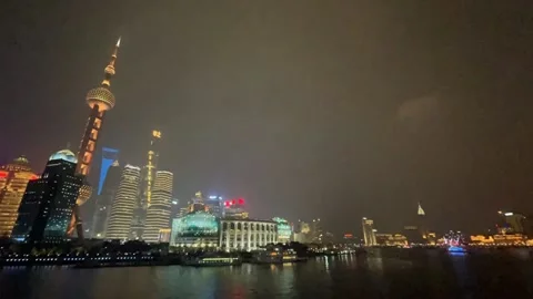 Timelapse Shanghai Bund Lujiazui light show at night by Huangpu River Stock Footage