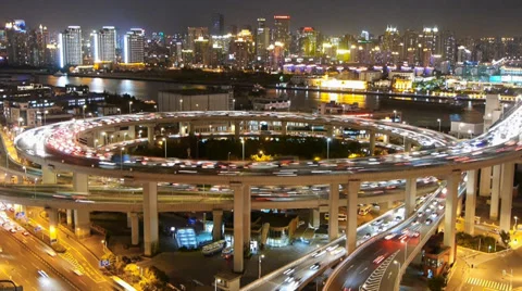 Timelapse shanghai traffic on highway interchange at night,urban cityscape. Stock-Footage 33309158