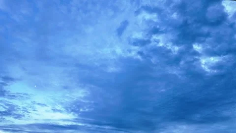 Timelapse of shifting clouds in vibrant blue sky Stock Footage 294950999