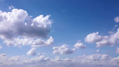 Timelapse shooting white clouds moving fast in the blue sky Stock Footage 150439498
