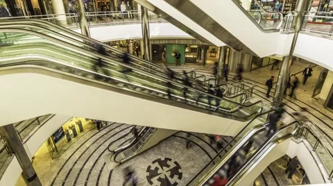 Timelapse of shoppers on escalators in shopping center Stock Footage