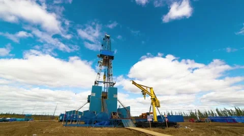 Timelapse shot of Blue Drilling rig on the background of moving clouds Stock-Footage 48442646