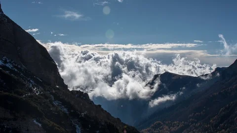 Timelapse shot of cloud formations on the snowy slopes of Gruppo del Carega Stock Footage 89836113
