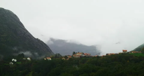 Timelapse shot of clouds moving in a smal mountain village Tibo, with its Stock Footage 221844579