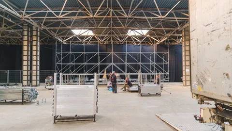 Timelapse shot of Large Indoor Stage Setup in Warehouse Видео 319817454