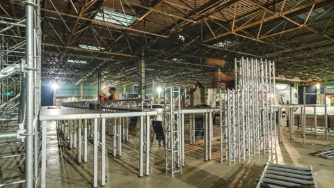 Timelapse shot of Large Indoor Stage Setup in Warehouse Видео 319817547