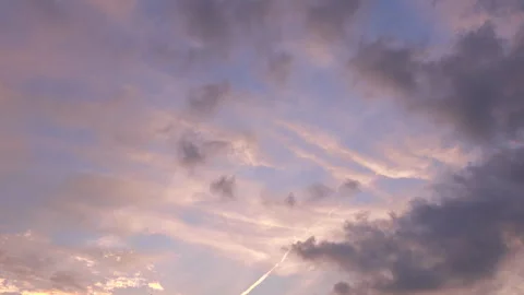 Timelapse shot of the movement of clouds in the blue sky at sunset. 4K Stock Footage 316271966