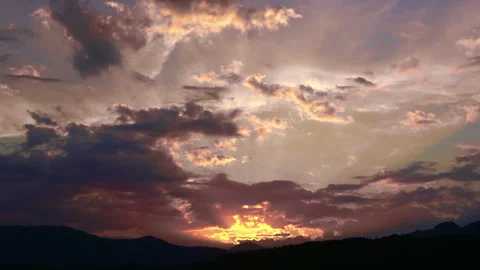 Timelapse shot of the movement of clouds at sunset. Autumn red sky at magic hour Stock Footage 286299445