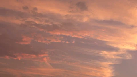 Timelapse shot of the movement of clouds at sunset. Pink sky at magic hour. 4K Stock Footage 316271973