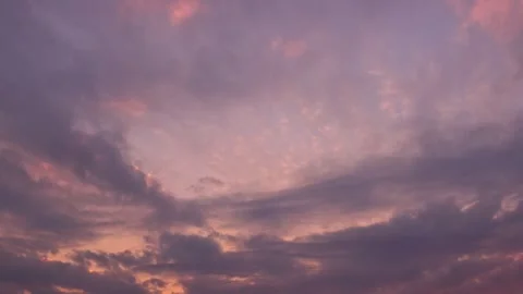 Timelapse shot of the movement of clouds at sunset. Skyscape at magic hour. 4K Stock Footage 336939060