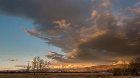 Timelapse shot of sunset and clouds moving over mountains Stock Footage 36311941