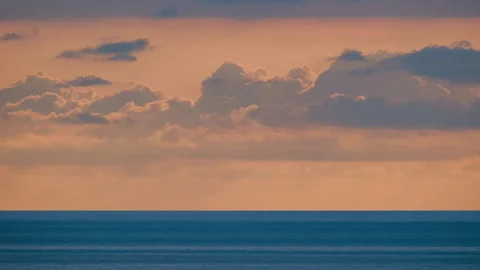 Timelapse shot of sunset over the sea. The clouds move quickly across the sky Stock-Footage 320885826