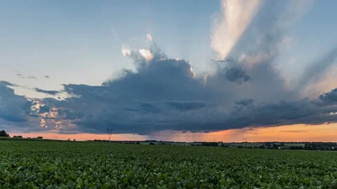Timelapse showing an approaching the isolated storm cloud and rainfall Stock Footage 301448002