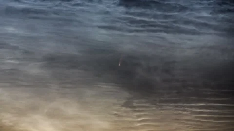 Timelapse showing the comet between moving noctilucent clouds. Stock Footage 301427634