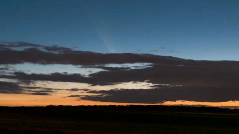 Timelapse showing the movement of the comet and clouds after sunset Stock Footage 301425356