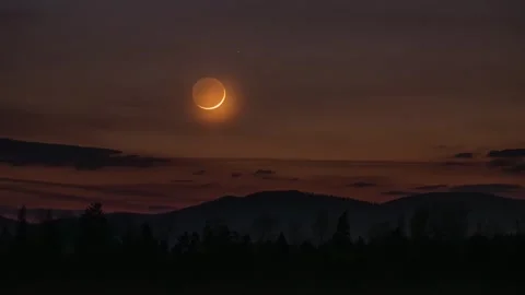 Timelapse showing the movement of the moon setting Stock Footage 301431654