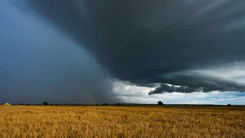 Timelapse showing a supercell thunderstorm and a rainbow Stock Footage 301430095