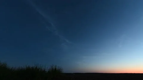 A timelapse of silvery clouds at night. Video stock 202888352