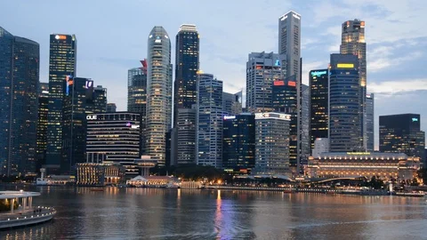 Timelapse of Singapore Skyline Skyscrapers in Financial District Marina Bay Dusk Stock Footage 95750426