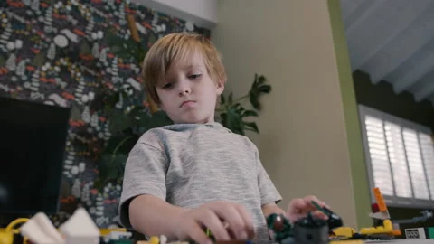 Timelapse of Six Year Old Boy Building and Playing with Legos Stock Footage 230284634