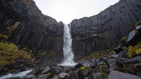 Timelapse of Skaftafell waterfall on a cloudy day Stock Footage 83699434