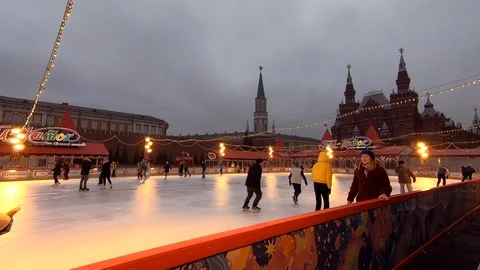 Timelapse skating people on ice. Christmas and New Year decorations Stock Footage 121213402