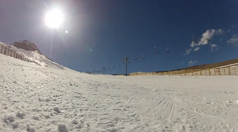 Timelapse of skiers skiing next to camera on ground 스톡 동영상 35061216