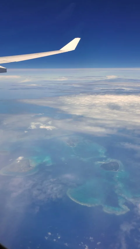 Timelapse of sky and clouds from airplane window, vertical shot Stock Footage 309119537