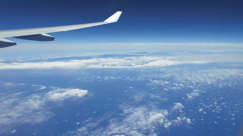Timelapse of sky and clouds from airplane window Stock-Footage 309119546