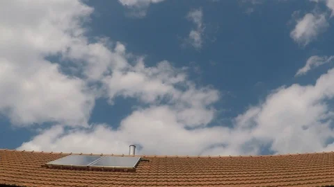 Timelapse of sky and clouds and roof view Stock Footage 126169946