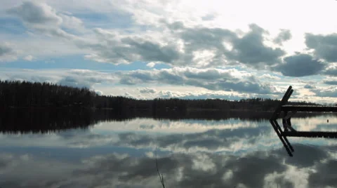 Timelapse of sky clearing over a lake Stock Footage 49688342