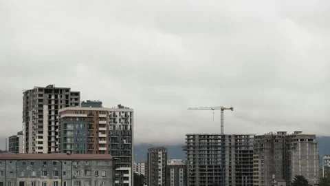 Timelapse of sky with dark heavy clouds hiding sun during sunset over city block Stock Footage 188707422