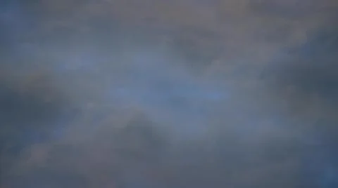 Timelapse of sky. Gray clouds are moving in the sky. Stock Photos