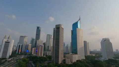 Timelapse of skyscraper building in Sudirman Central Business District at sunset Stockbeeldmateriaal 154228959