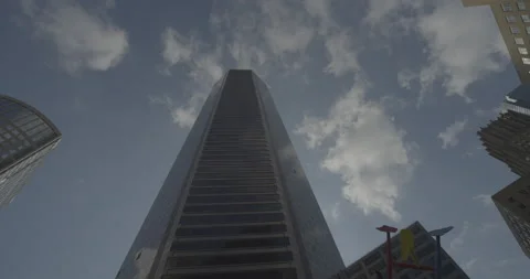 Timelapse of a skyscraper with clouds reflecting on the glass walls Stock Footage 149329065